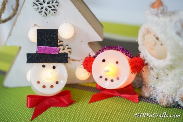 Close up picture of snowman and santa christmas candles