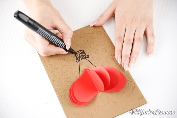 Drawing a hot air balloon basket onto craft paper 3D card