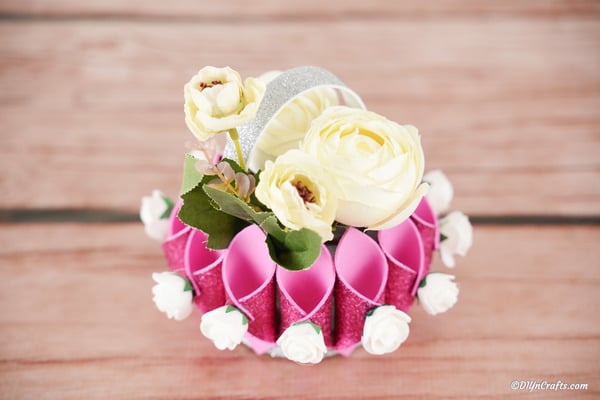 Overhead picture of paper flower basket on wooden table