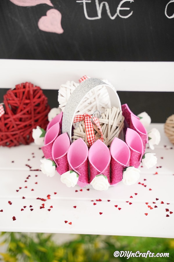 Pink glitter basket filled with valentine's 