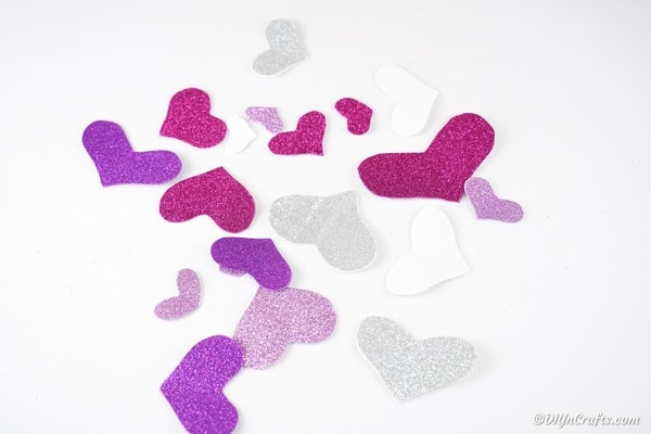 Colorful hearts on white table