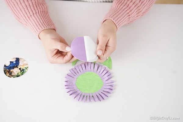 Trimming purple foam paper to fit card