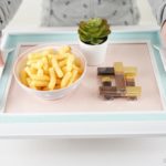 Picture frame tray with bowl of cheese puffs