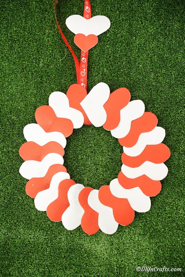 Heart valentine's wreath laying on grass