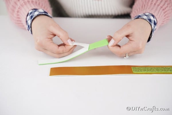 Cutting strips of paper out for basket handle