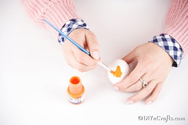 Painting the egg orange