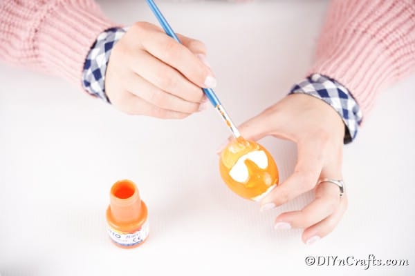 Painting the eyes onto the egg