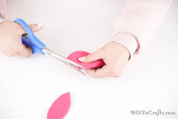 Cutting out pink paper