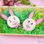 Wood slice easter bunnies in fake grass
