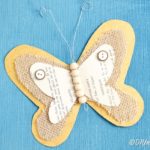 Burlap butterfly on blue surface