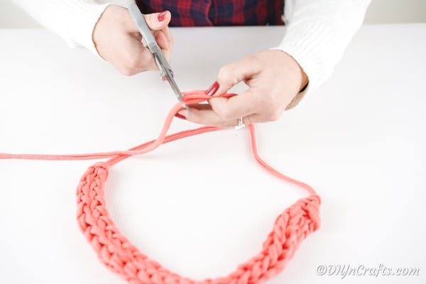 Tying off end of finger knit necklace