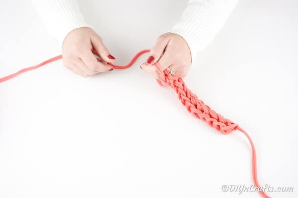 Tying the necklace before wearing