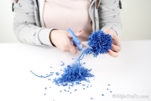 Trimming edges off a cloud pom pom 