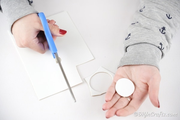 Cutting circle of white paper