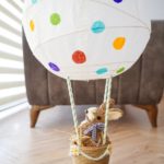 Easter hot air balloon on floor by chair