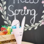 Easter bunny candy holder on table by chalkboard