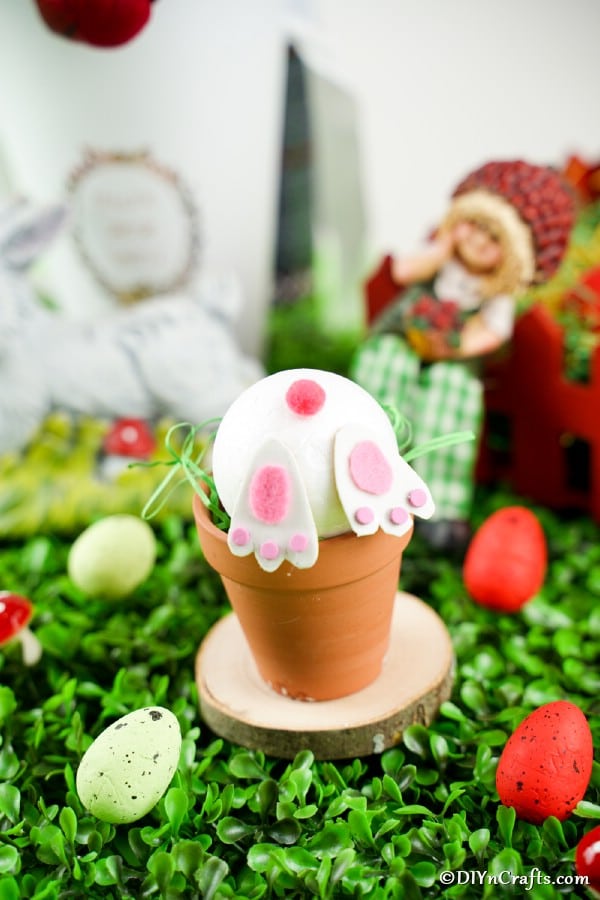 Bunny butt flower pot in front of Easter decor