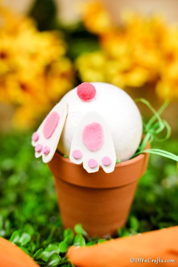Bunny butt flower pot craft on grass