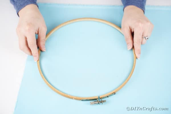Measuring fabric on embroidery hoop