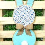 Fabric bunny wall art in front of pallet