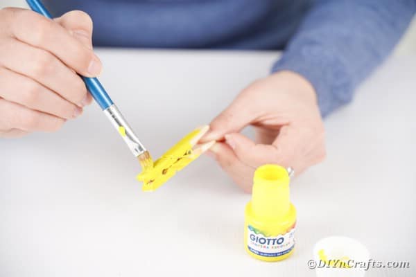 Painting clothespin yellow