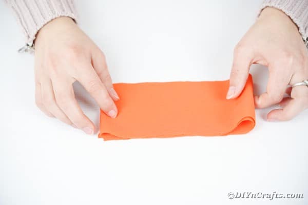 Folding orange fabric
