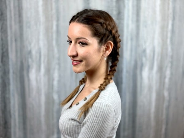 Smiling brunette with double dutch braids