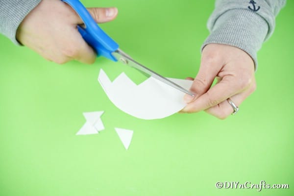 Trimming paper into cracked egg shape