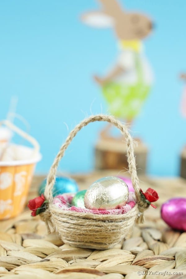 Twine wrapped mini Easter basket on woven mat