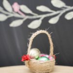 Egg crton basket in front of chalkboard