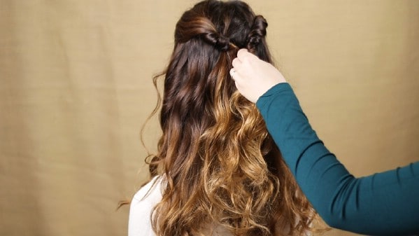 Securing hair in place with bobby pin