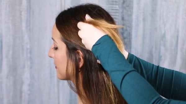 Pulling hair through ponytail 