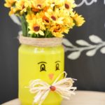Yellow mason jar vase by chalkboard