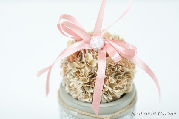 Old book flower ball on silver jar