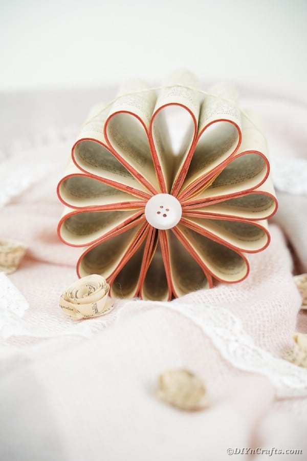 Paper flower on counter with fabric