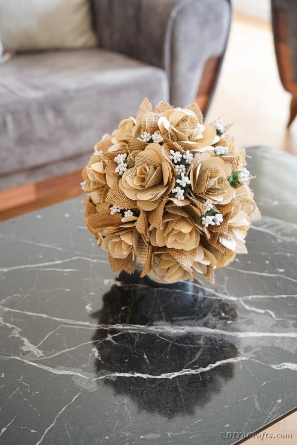 Paper rose flower bouquet on coffee table