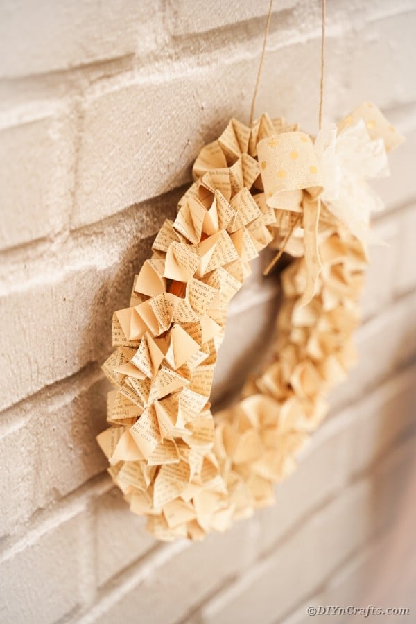 Origami paper wreath on brick wal