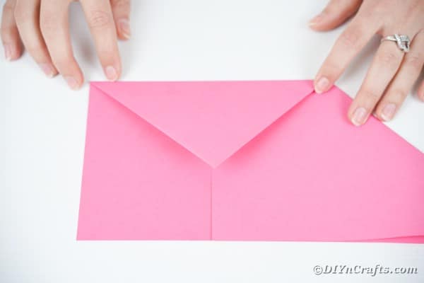 Folding over envelope flap of paper