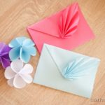 Origami envelope on wooden table
