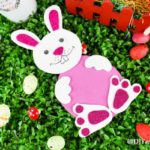 Foam paper Easter bunny laying on grass