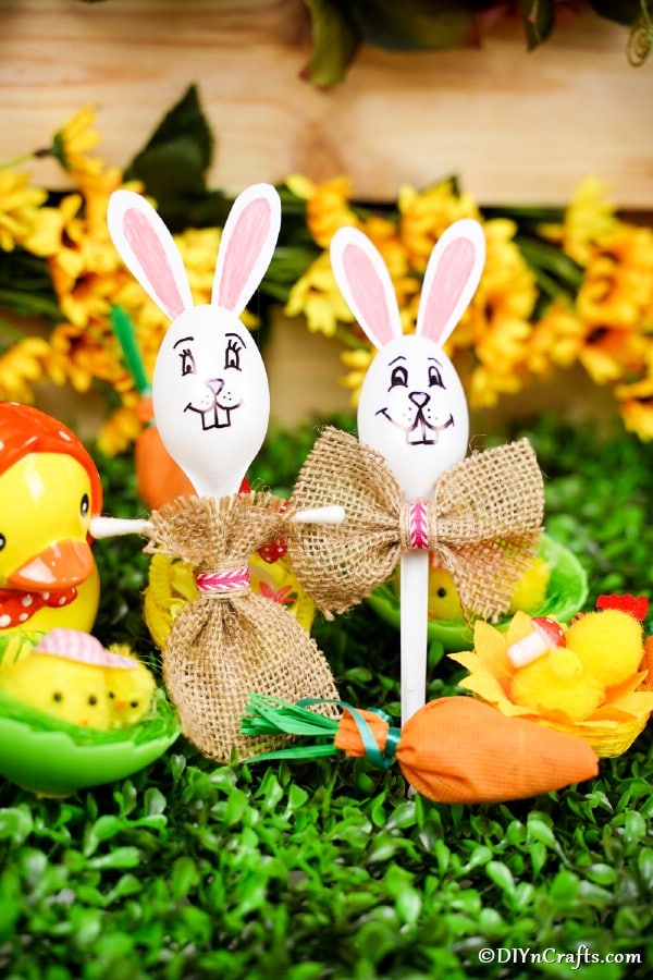 Easter bunny spoons on grass with Easter decor