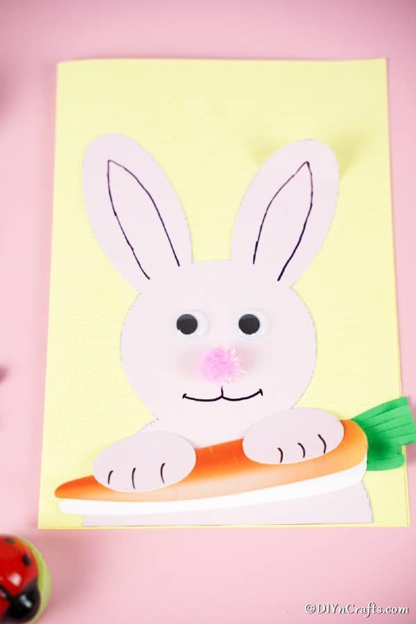 Printed Easter bunny card on pink surface