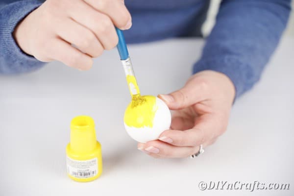 Painting eggs yellow