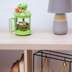 Spring nest lantern on table by lamp