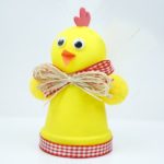 Upcycled planter chicken Easter craft on white table