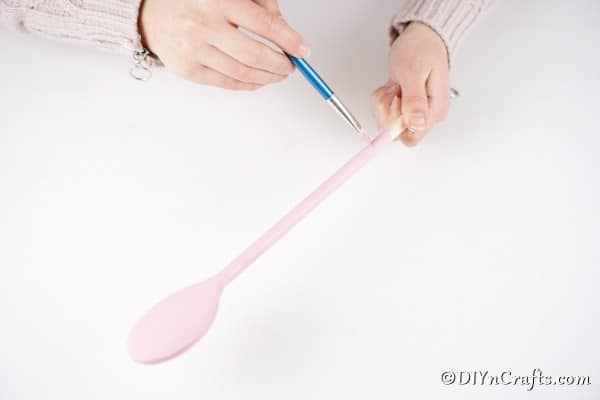 Painting wooden spoon pink