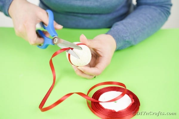 Gluing ribbon onto middle of egg