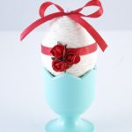 Blue egg cup with white and red egg