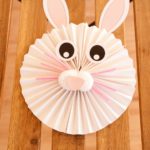 Paper fan bunny on wooden surface