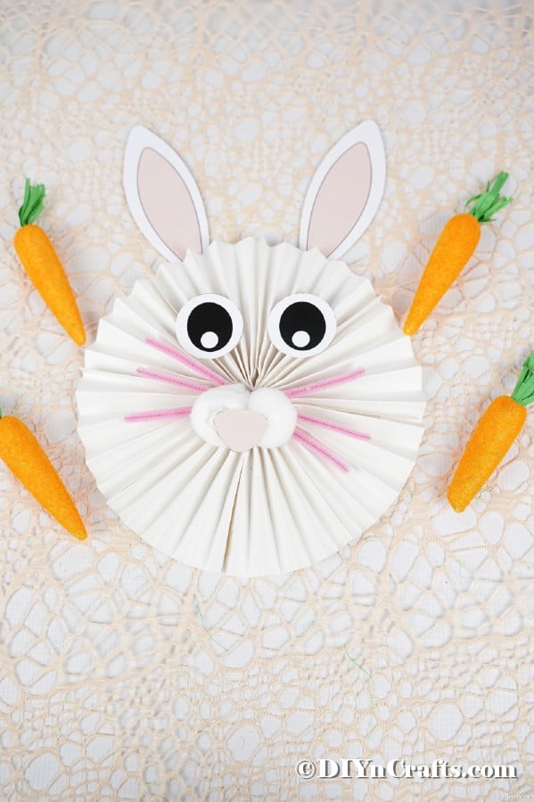 Paper fan bunny on lacy tablecloth